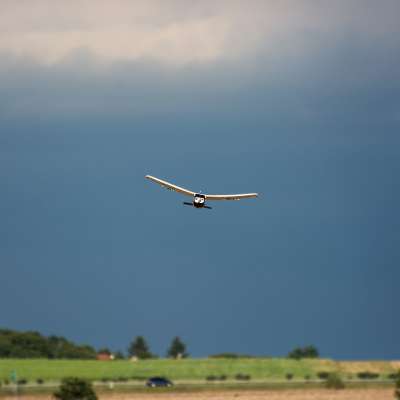 Rc plane and dark sky. Outdoor activity.